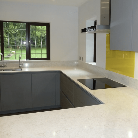 Sleek Silestone Lusso sample in a contemporary white kitchen, emphasizing its seamless integration and subtle veining.