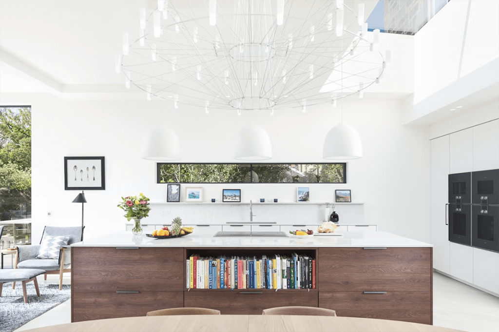 Silestone Lusso countertop sample in a modern white kitchen, showcasing elegant white quartz with subtle veining for a bright and airy kitchen design.
