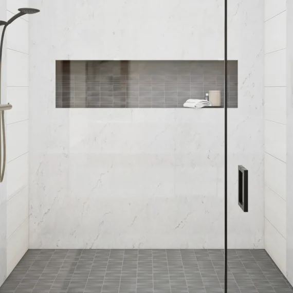 A luxurious shower surround featuring Mystique Polished Pental Quartz, showcasing its elegant veining and polished finish.