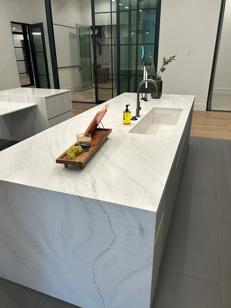 A sleek and modern custom countertop with a seamlessly integrated sink, creating a clean and minimalist aesthetic.