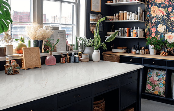 Art room installation featuring a spacious Calacatta Premata Premium Natural Quartz countertop, showcasing its elegant white surface and subtle veining in a creative space.